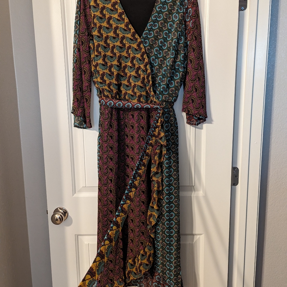 This dress is a size 22/24 W it is multicolor and has a built around the waist.